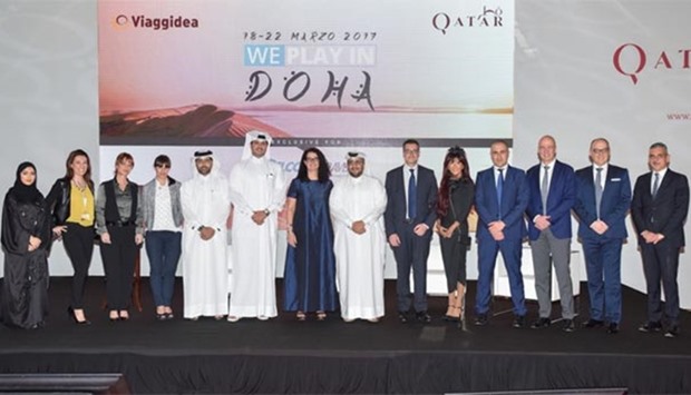 Hassan al-Ibrahim and other QTA officials with Italian travel agents.