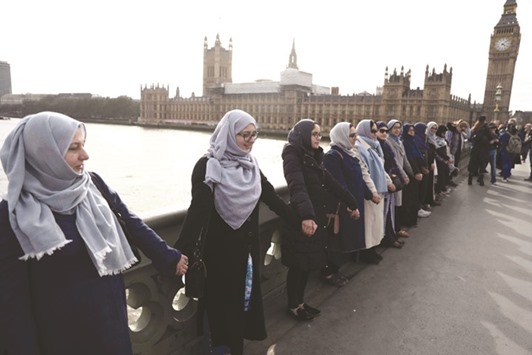 Participants of the Womenu2019s March gather on Westminster Bridge in London yesterday to remember victims of the attack in Westminster earlier in the week.