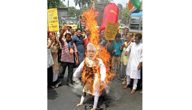 Youth Congress activists stage a demonstration against the hike in prices of cooking gas in Kolkata, yesterday.
