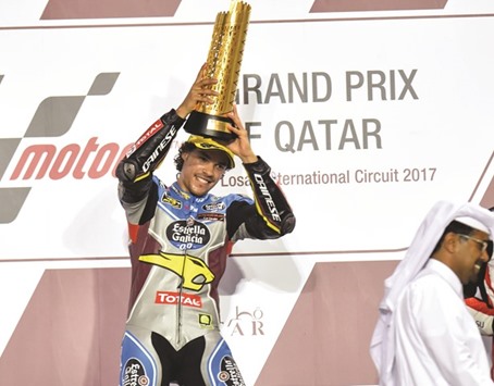 Italyu2019s Franco Morbidelli celebrates with this Moto2 trophy yesterday at Losail.