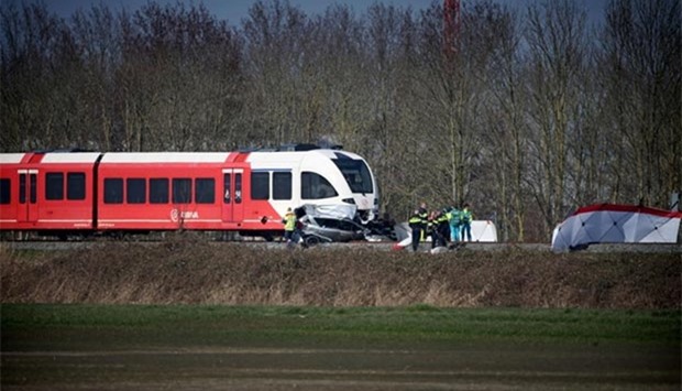 Emergency personnel work at the scene of a train crash near Harlingen, northern Netherlands on Monday.