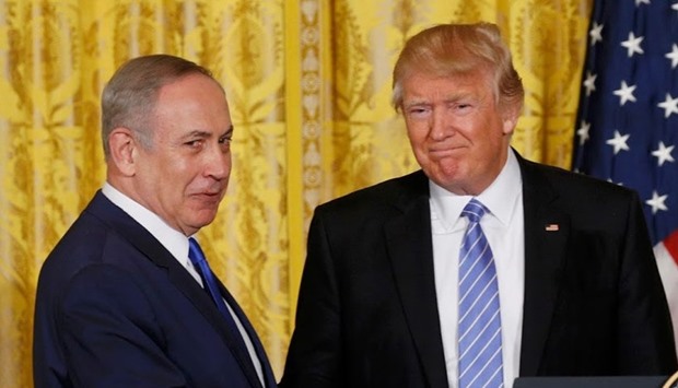 US President Donald Trump (R) greets Israeli Prime Minister Benjamin Netanyahu