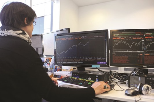 A trader working at the London Stock Exchange. The FTSE 100 ended 0.6% down at 7,293.50 points yesterday.