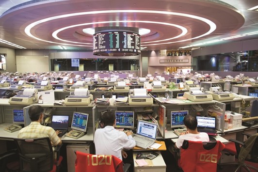 Traders work at the Hong Kong Stock Exchange. One of the most striking things about the 85% plunge in Huishan Dairy Holdings Cou2019s stock on Friday was how little it surprised market observers in Hong Kong.