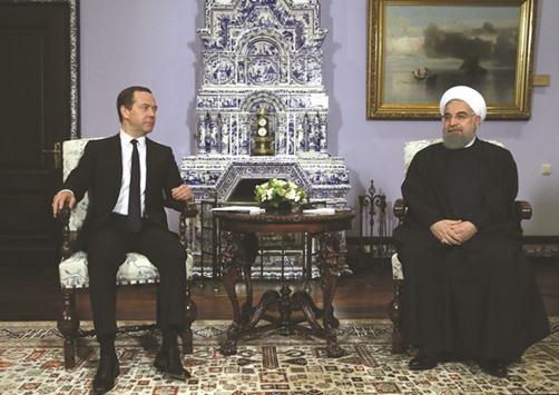 Russian Prime Minister Dmitry Medvedev meets with Iranian President Hassan Rouhani at the Gorki residence outside Moscow yesterday.