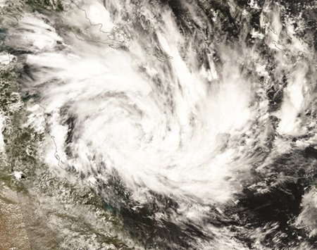 A photo released by Nasa shows a satellite image of Cyclone Debbie in the Coral Sea off the state of Queensland. Cyclone Debbie has been forming off the coast of Queensland state over recent days, the Bureau of Meteorology said, and is expected to make landfall today.