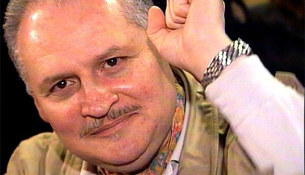 Ilich Ramirez Sanchez, better known as ,Carlos the Jackal,, raises his fist as he appears in court in Paris in this file photo.