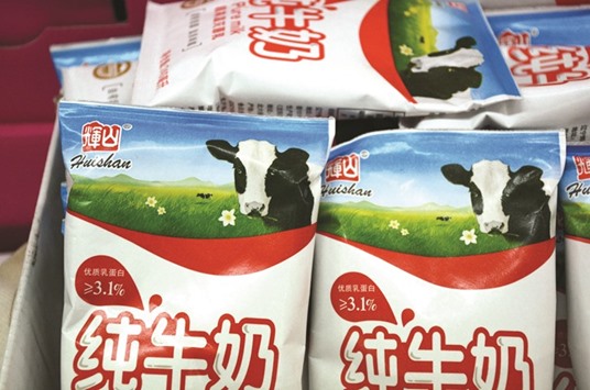 Products of Huishan Dairy are seen at a supermarket in Shenyang, Liaoning province. Chinau2019s largest integrated dairy firm denied reports of fraudulent invoices and stolen cash, but laid out the depth of its unfolding crisis in a lengthy statement, including that almost all of the shares owned by its controlling shareholder had been pledged as collateral.