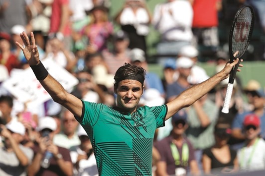 Roger Federer of Switzerland celebrates after winning match point against Juan Martin del Potro of Argentina (not pictured) on day seven of the 2017 Miami Open.