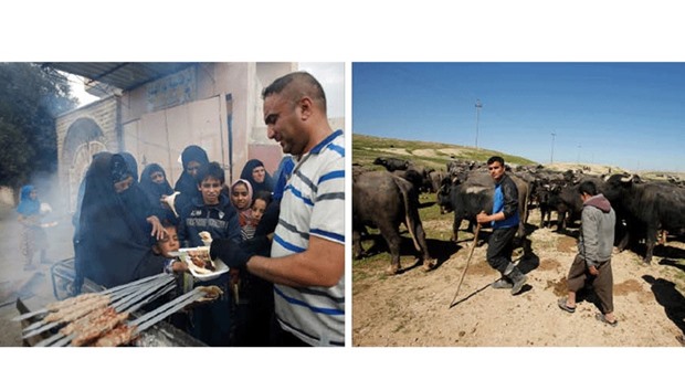 An Iraqi volunteer (right) gives food to displaced people during a battle with Islamic State militants in Mosul, yesterday. Right: Displaced Iraqi farmers from Badush, northwest of Mosul, who fled their village and later returned to retrieve their buffaloes go about their day as the battle against Islamic Stateu2019s fighters continues in Mosul.