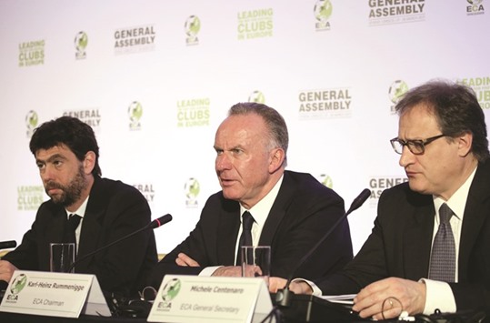 European Club Association chairman Karl-Heinz Rummenigge (C) and other ECA officials attend a news conference.