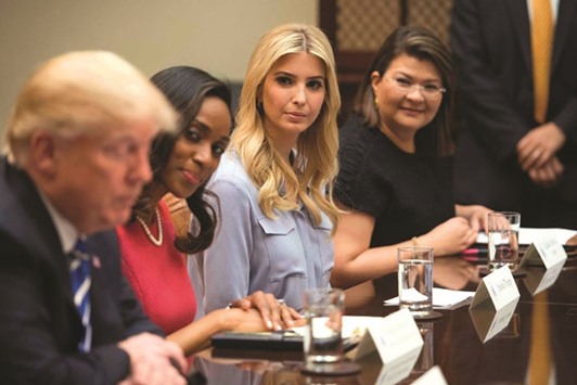 Ivanka Trump looks on as President Donald Trump speaks during a roundtable with women small business owners at the White House in Washington.