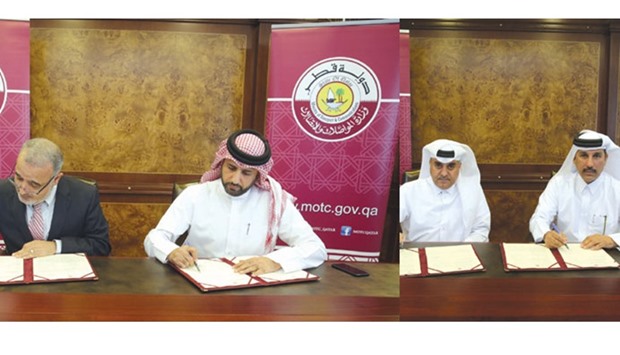 Assistant undersecretary of Land Transport Rashid Taleb al-Nabet and QMIC executive director and CEO Dr Adnan Abu-Dayya sign the MoU. Hassan al-Hail, adviser to HE the Minister of Transport Jassim Seif Ahmed al-Sulaiti and Smart Transport chairman Abdulaziz Ali bin Hamad al-Attiyah during the signing ceremony.