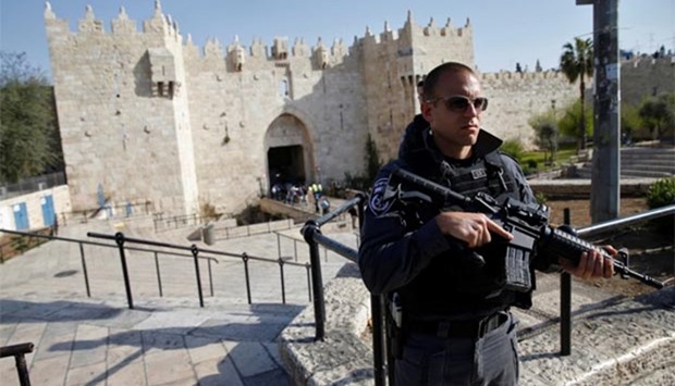 An Israeli policeman stands guard near the scene of an attempted stabbing attack at Damascus Gate in Jerusalem's Old City on Wednesday.