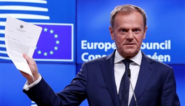 European Council President Donald Tusk shows British Prime Minister Theresa May's Brexit letter, in Brussels on Wednesday.