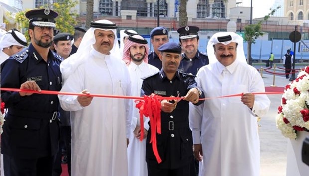 Brig Mohamed Ahmad al-Ateeq, along with other officials, cuts a ribbon to inaugurate the new services centre at The Pearl-Qatar yesterday. PICTURES: Shaji Kayamkulam.