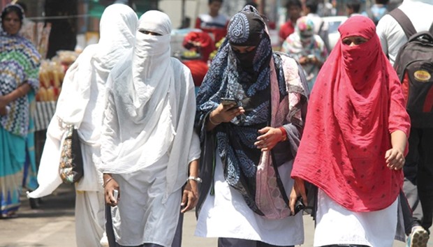 Women cover their faces to protect them from the searing heat in Nagpur yesterday. The city is reeling under an intense heatwave with the temperature crossing 40 degrees Celsius.