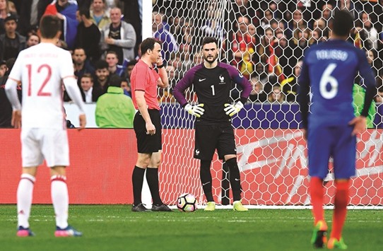 Referee Felix Zwayer (2L) valids a goal after the decision of the arbitration video during the friendly match between France and Spain at the Stade de France stadium in Saint-Denis, north of Paris. (AFP)