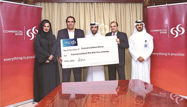 The winners with Commercial Bank executives.