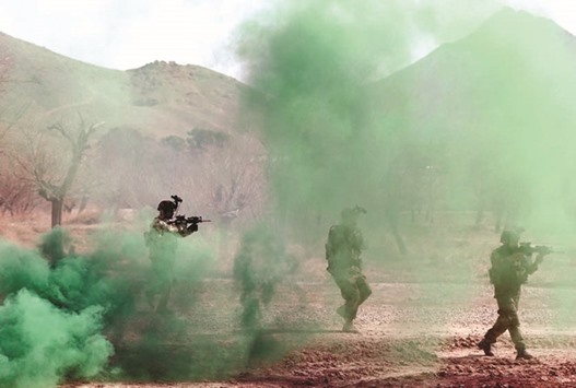 Afghan army Special Forces take part in a military exercise in Rishkhur district outside Kabul on February 25.