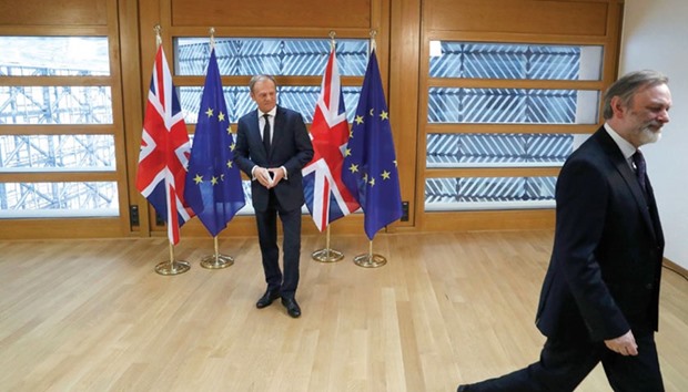 Britainu2019s permanent representative to the European Union, Tim Barrow, leaves after he delivers Prime Minister Theresa Mayu2019s Brexit letter to EU Council president Donald Tusk in Brussels, Belgium, yesterday.