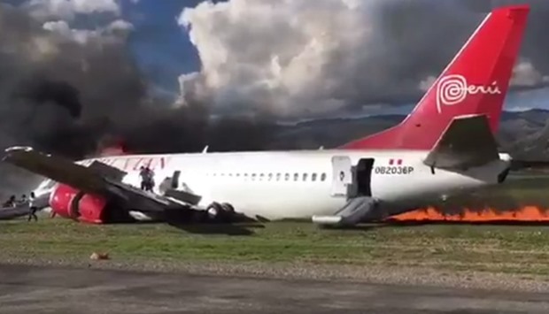 Screengrab  showing a Peruvian Airlines plane on fire