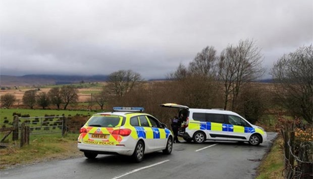 Police near the scene of the crash in Wales. Picture: Press Association.