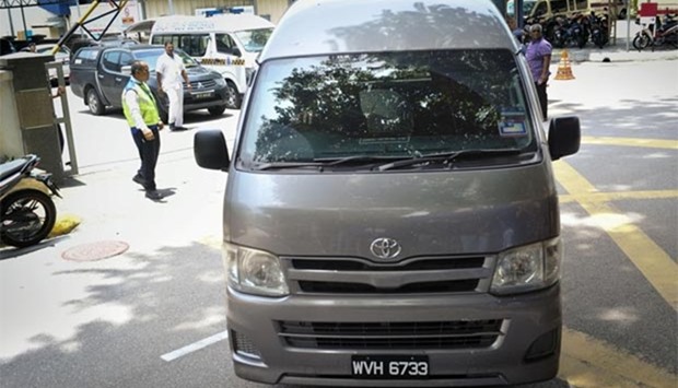 A van believed to be carrying the body of Kim Jong Nam leaves the Kuala Lumpur Hospital on Thursday.