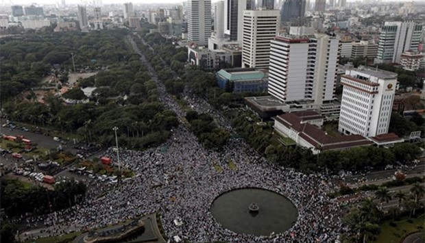 Indonesian protesters turn up in large numbers for a rally calling for the removal of Jakarta's governor Basuki Tjahaja Purnama on Friday.