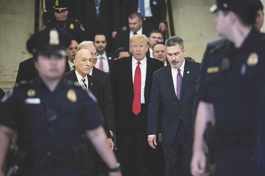 President Donald Trump arrives to meet with House Republicans about the new healthcare law at the US Capitol in Washington.