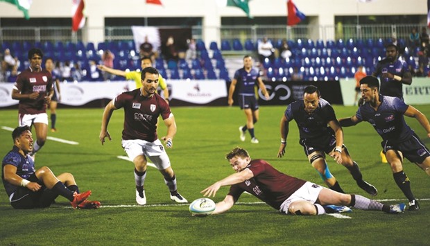 Qataru2019s David Ford attempts to get hold of a loose ball during the pool stage match against the Philippines in the Asian Rugby Sevens Trophy at Aspire Warm Up and Rugby Stadium yesterday. PICTURE: Jayaram