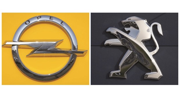 A combination picture shows the logos of Opel and Peugeot car manufacturers at dealerships of the brands in Strasbourg, France. PSA Group is set to announce a deal to buy Opel from General Motors tomorrow after striking an agreement with the US carmaker and winning the blessing of its board for the acquisition.