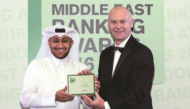 A QNBFS representative (left) receiving award from EMEA Finance in Dubai recently.