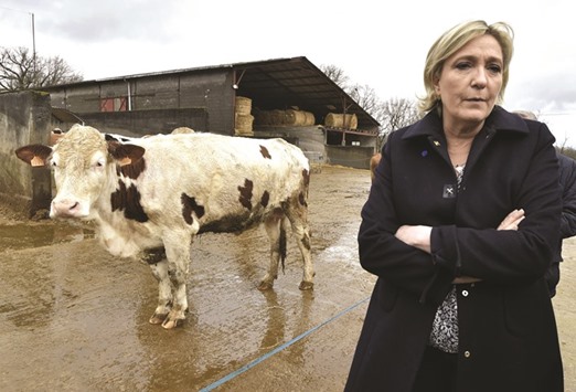 Le Pen visiting a farm in Cambes, southern France yesterday as part of her campaign trail.
