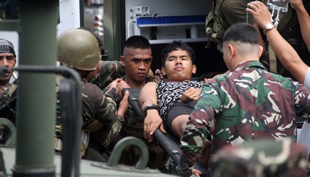 Philippine soldiers, wounded in an ongoing clash with Islamist militants from the Abu Sayyaf group, arrive at a military hospital in Jolo, Sulu province, on the southern island of Mindanao on March 3, 2017.