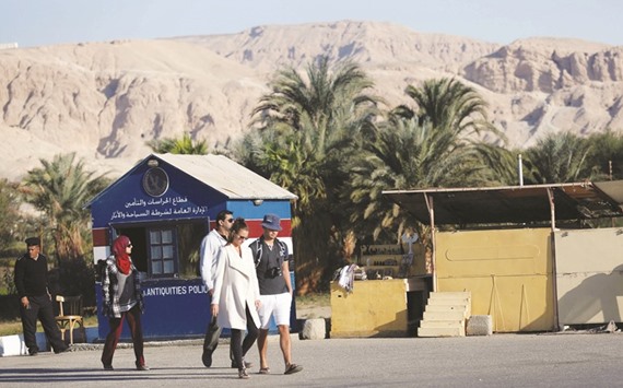 Tourists walk beside a Tourism and Antiquities police point near souvenir shops in the port city of Luxor, south of Cairo (file). The Emirates NBD Purchasing Managersu2019 Index for the whole economy climbed for the third month in a row to 46.7 in February from 43.3 in January. The New Orders sub-index rose to 44 from 39.2.