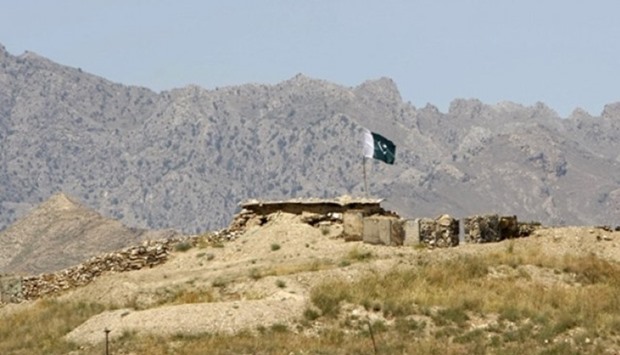 A Pakistani flag flies on top of a Pakistani check post at the Goshta district of Nangarhar province, where Afghanistan shares borders with Pakistan
