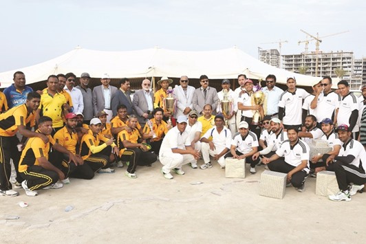Winners Mcdonaldu2019s and runner-up QVC pose after the final of the second division title of the 28th CDC cricket tournament.