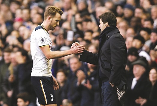 File picture of Tottenhamu2019s Harry Kane (left) shaking hands with manager Mauricio Pochettino during an EPL game.