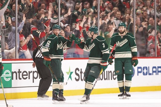 Minnesota Wild forward Eric Staal (left) celebrates his goal in the third period against the San Jose Sharks in Saint Paul, Minnesota, on Sunday. (USA TODAY Sports)