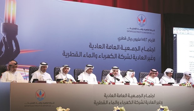 HE the Minister for Energy and Industry Dr Mohamed bin Saleh al-Sada (fourth left) and other officials at the QEWC AGM yesterday. PICTURE: Jayan Orma