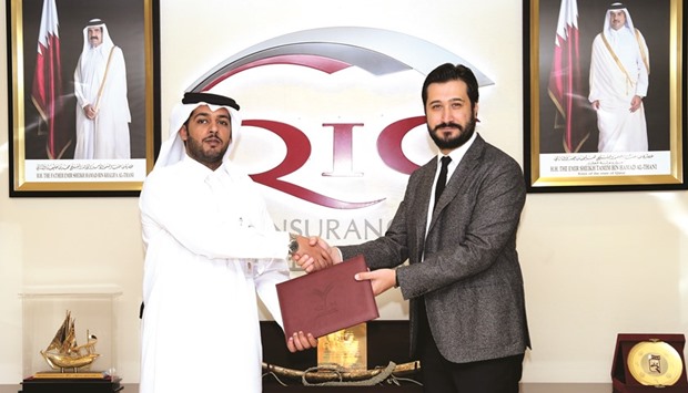 Al-Mannai and Dr Uygunucarlar after inking the pact.