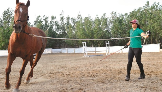 Saudi Dana al-Gosaibi trains a horse in the Red Sea city of Jeddah.