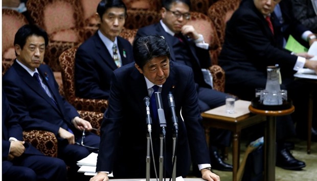Japan's Prime Minister Shinzo Abe (C) speaks at the upper house parliamentary session after reports on North Korea's missile launches, in Tokyo.