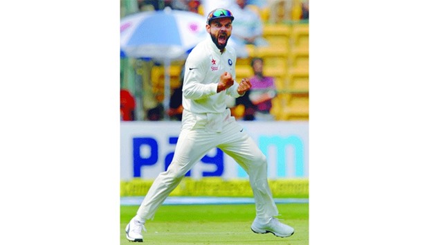 Indian captain Virat Kohli celebrates the dismissal of Australian batsman Matthew Wade yesterday.