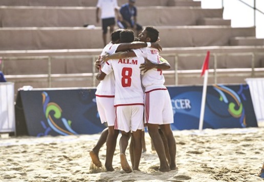 UAE players celebrate their victory over Qatar.