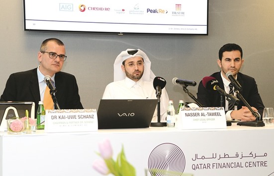 From left: Schanz; al-Taweel and Gokhan Celik, head of banking at QFC, unveil the Mena Insurance Pulse.