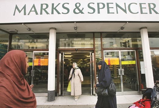 Shoppers pass by a Marks & Spencer shop in central London (file). The foundation of the strong Islamic finance industry in the UK is the countryu2019s considerably large Muslim population, which makes 4.5% of the nationu2019s total. More than 1mn of the 2.8mn Muslims living in the UK reside in London.