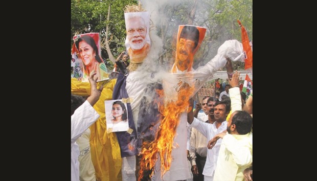 Trinamool Congress workers stage a demonstration against the central government in Kolkata yesterday.