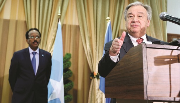Guterres addresses a news conference after his meeting with President Mohamed (left) in Mogadishu.